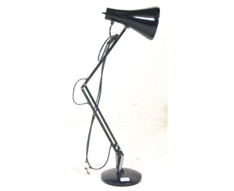 A vintage retro 20th Century anglepoise desk lamp having a round base with curved conical shade retaining original black pain