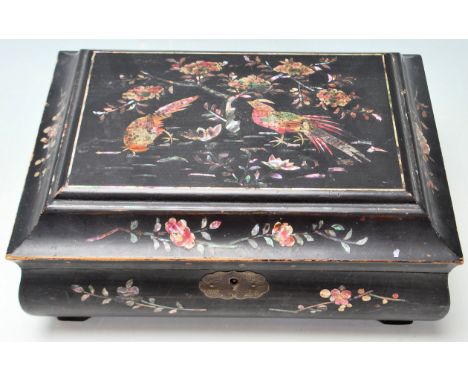 An early 20th Century Chinese pagoda shaped black lacquer jewellery box / work box decorated in gilt chinoiserie and mother o