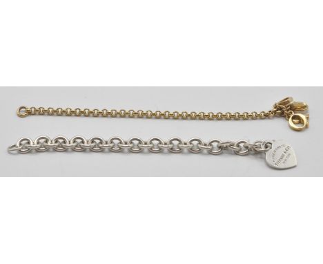 A sterling silver charm bracelet with adorned lobster clasp. The heart shaped pendant marked Tiffany &amp; Co&nbsp; New York 