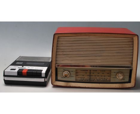 A vintage retro 20th century ITT Recorder SL 54 automatic / tape recorder together with a EKCO valve radio in a red metal cas