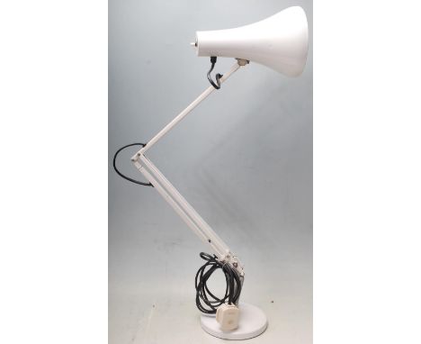 A vintage 20th Century Herbert Terry Industrial anglepoise desk lamp in a white colourway, raised on circular base with adjus