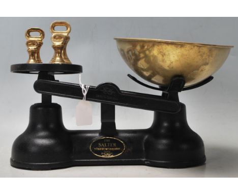 A set of retro vintage industrial late 20th Century cast iron weighing scales by The Salter Staffordshire. The scales have a 