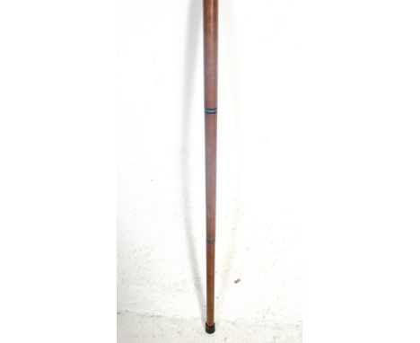 A vintage antique style wooden walking stick having a brass shaped handle which unscrews to reveal a secret drinking vessel s