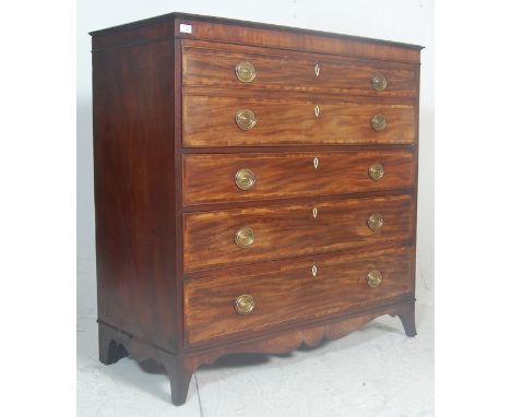 A 19th century George III mahogany and satinwood line inlaid secretaire bureau chest of drawers. Raised on French bracket kic