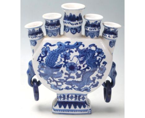 A 20th Century Chinese blue and white porcelain candlestick holder / candelabra having five scones to the top with rounded bo