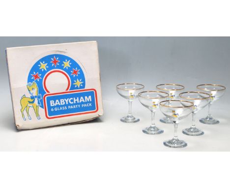 A selection of 20th Century vintage retro Babycham glasses having printed yellow fawn logo's to the bowls and blue lettering 