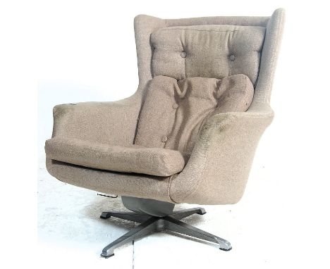 A retro mid century / 1970's period swivel easy chair - armchair. The chair being raised on a four point chrome swivel base w