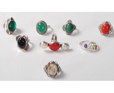 A collection of 9x vintage assorted ladies white metal and .925 sliver dress rings with stones to include moss jade coloured,