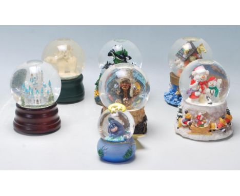 A collection of seven original vintage collectable glass snow globes to include: two angels playing on a polar bear, Noahs Ar