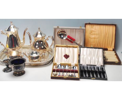 A good collection of 20th century silver plate boxed flatware sets and a boxed full four pice tea service with tray along wit
