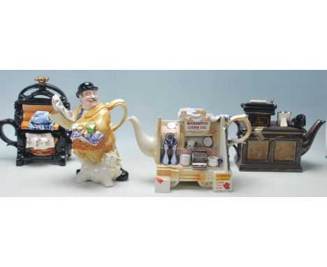 A collection of four Paul Cardew Designs novelty ceramic teapots comprising a twin pedestal desk, press, gentleman and a shop
