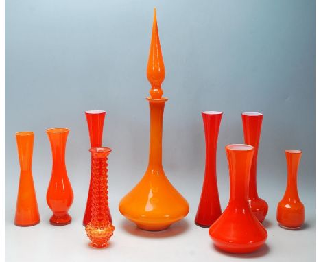 A mixed collection of retro vintage late 20th Century studio glass ware in burnt orange to include a waisted neck vase, flare