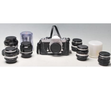A 20th century vintage NIKKORMAT FT3 camera No 6038058 along with Nippon Kogaku Japan No 235974 Nikkor-S Auto 1:2.8 f=35mm, N