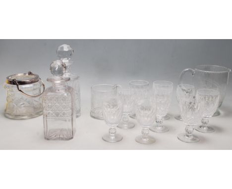 A set of vintage Waterford crystal wine and sherry glasses having faceted sides with cut glass geometric decoration, a cut gl