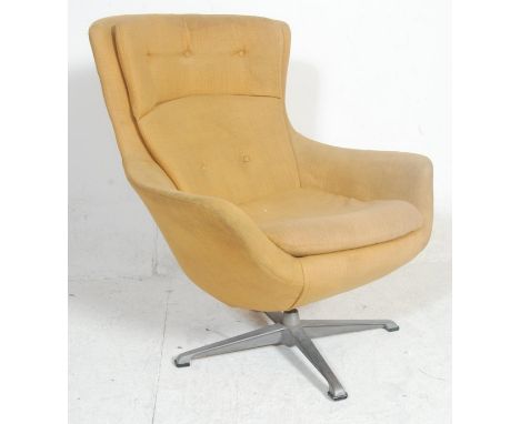 A vintage mid century retro Danish inspired egg chair&nbsp; - easy swivel armchair. The chair being upholstered with yellow f