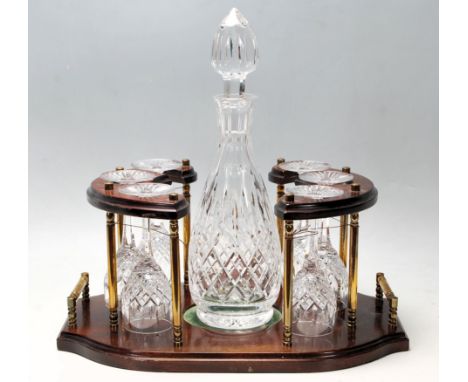 A 20th Century vintage cut glass decanter and glass set consisting of a bottle decanter complete with stopper and six matchin