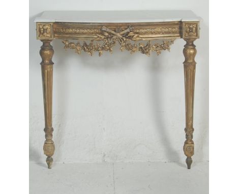 A 19th century French rococo marble and gilt wood console table. The hall / side table being raised on gilded tapering reeded