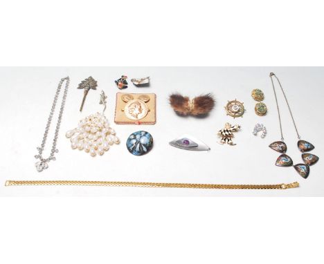 A collection of retro vintage late 20th Century costume jewellery to include an enamel necklace, a trifari brooch, a napier n