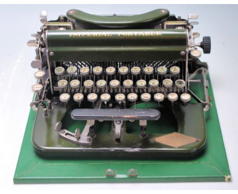 An vintage early 20th century typewriter by Imperial having a green enamel colourway with gilt lettering. Stamped " R " to th