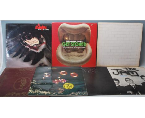 A collection of vintage 12” vinyl rock records to include The Stranglers - live X cert, The Rolling Stones - Get Stoned, The 