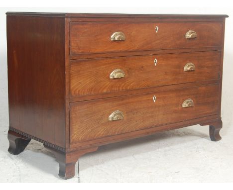 A 19th Century Victorian mahogany attic chest / bachelors chest having three drawers with brass shell shaped handles raised o