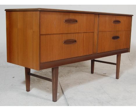 A good vintage retro 20th century G plan teak wood sideboard having a bank of four drawers raised on tapered supports united 