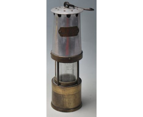 A good early 20th century &nbsp;Miners safety lamp by J.H.NAYLOR LTD WIGAN. having aluminium and brass body.