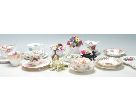 A collection of vintage early 20th Century fine bone china tea cups, trios and flower posies by Royal Albert Moss Rose, Royal