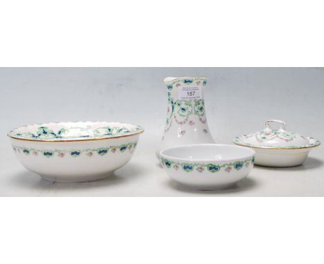 A 19th Century Victorian china bath wash set by Bisto for Harrods of London. The wash set comprises of a water decanter, soap