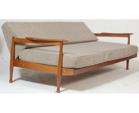 Guy Rodgers ( British 20th century ) A Manhattan style teak wood sofa / day bed, by Guy Rodgers. The teak frame three-seat so