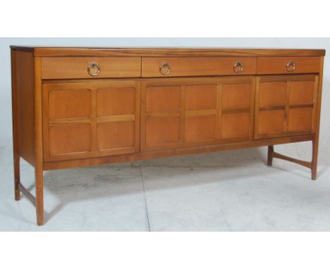 A vintage 20th Century 1970's retro Nathan Long John teak wood sideboard credenza raised on shaped legs having quarter panel 