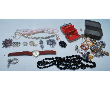 A good collection of 20th century costume jewellery and watches to include necklaces brooches, Kentart enamelled dog badges a