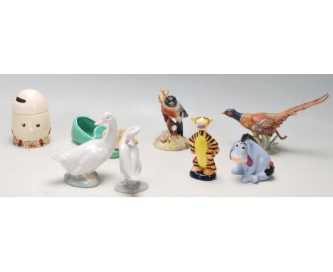 A good collection of 20th century assorted porcelain animals figurines to include Nao, Lladro, Disney, Sylvac, Poole, W Goebe