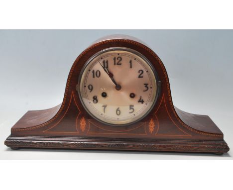 An Edwardian early 20th Century mahogany inlaid Napoleon's hat mantel clock by Baldwin &amp; Gillett. The clock having a dome