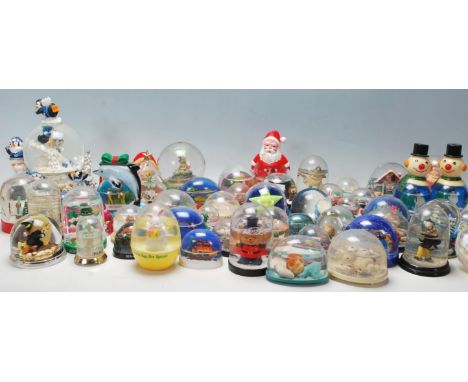 A large collection of original vintage collectable plastic snow globes from around the world to include, Niagra Falls, The Co