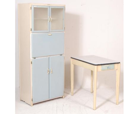 A retro vintage mid century 1950s kitchen cabinet and table set by County in a blue and white colourway. The cabinet comprisi