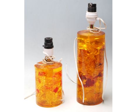 Prove - Shatterline - A pair of vintage 20th Century tangerine orange / amber coloured lamp bases of cylindrical form, one la