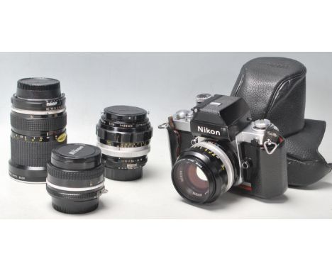 A vintage Nikon F2 camera No: 7460757 with NIKON NIKKOR S C Auto 1:1.4 f=50mm lenses No. 1550356 together with two NIKON lens