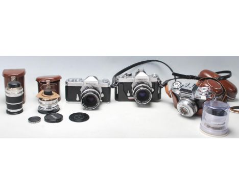 A group of vintage 35mm cameras to include : NIKKOTMAT FT No 4526994 with Nikon Nikkor-H Auto 1:2 f=50mm No 2005782 lenses, Z