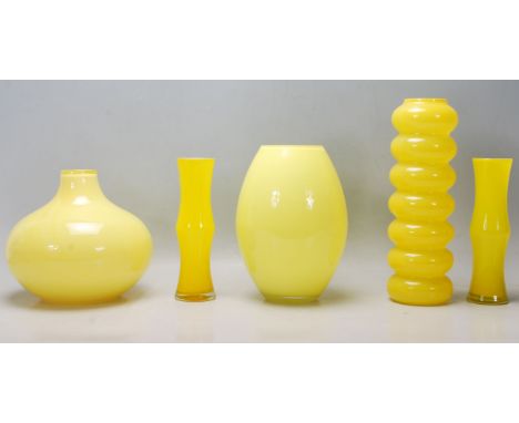 A mixed collection of retro vintage late 20th Century studio art glass ware in canary yellow to include a waisted neck vase, 