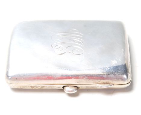 An early 20th Century Edwardian silver hallmarked cigarette case having engraved initials W J G to the front with push button