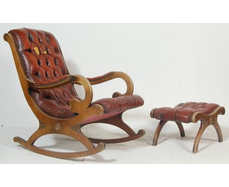 A late 19th Century early 20th Century Victorian red leather button backed chesterfield style rocking chair having upholstere