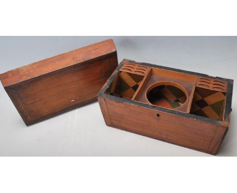 A 19th Century Victorian tea caddy of sarcophagus form having a central recess for a mixing bowl with recesses for spoons, be