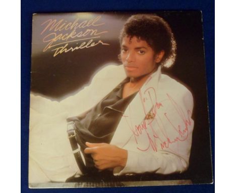 Autograph, Michael Jackson, signed and inscribed album record sleeve for Thriller, signed in red ink to the cover. Record sti