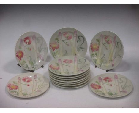A set of twelve asparagus plates marked St Clement, FranceCondition report: Various minor chips and losses of enamel to the e