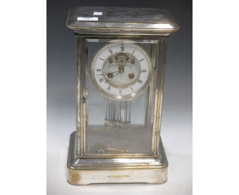 A four glass mantel clock within a silvered case, with mercury pendulum, 35cm high