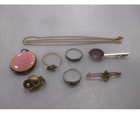 A collection of jewellery including a guilloche enamel pendant, tested as silver, three gold rings, a gold pendant, a broken 