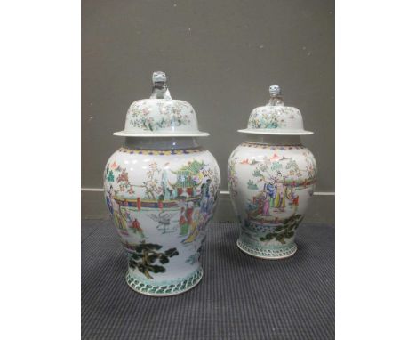 A pair of large Chinese baluster vases, the lids with dog of Fo finial, 60cm high