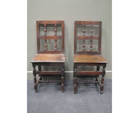A pair of upright panel chairs in 17th century style