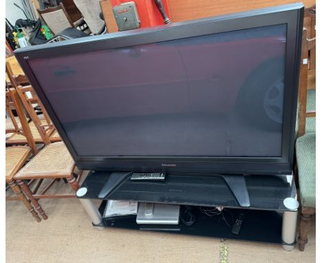 A Panasonic 50" Plasma television, model number TH-50PX7B on a glass stand (untested)